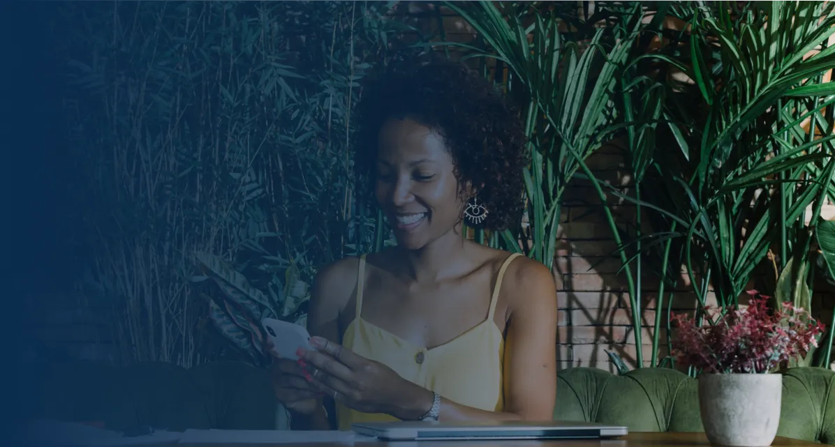 young-woman-sitting-restaurant-using-smartphone